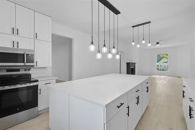 a view of chairs in balcony with wooden floor