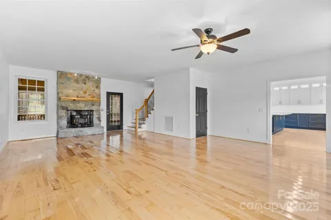a view of livingroom with hardwood floor and a ceiling fan