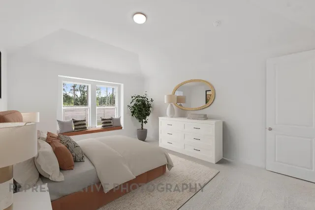 a bedroom with a bed and a dresser