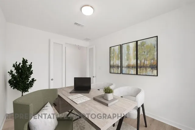 a workspace with furniture and window