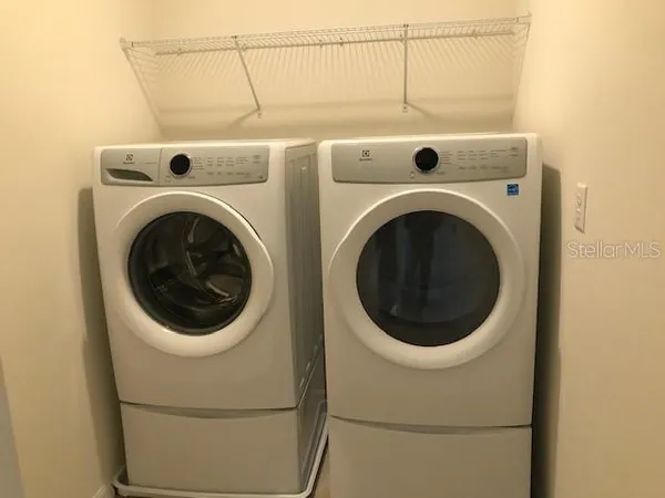 a utility room with dryer and washer