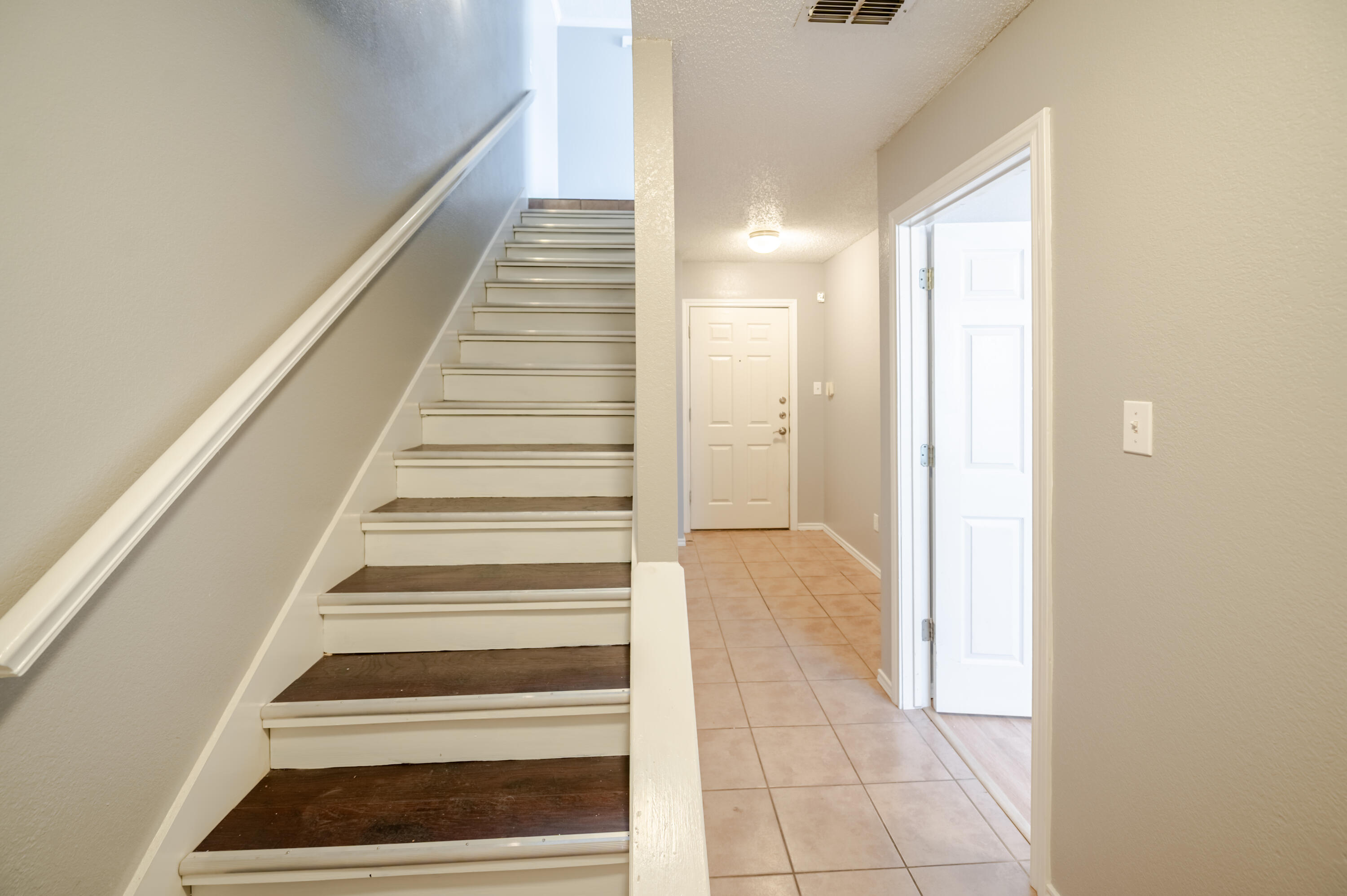 2111 Main Street, Unit 1 Lubbock, TX 79401 - Photo 13 of 36 a view of an entryway with staircase