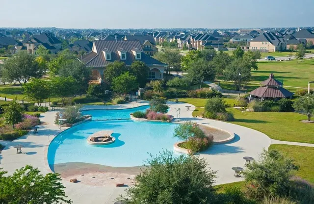a view of a swimming pool with lounge chairs