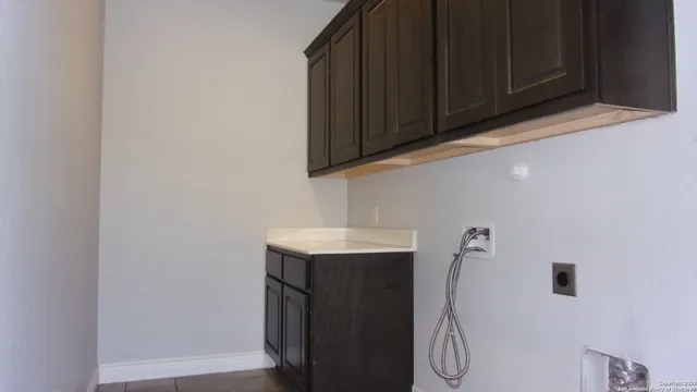a bathroom with a sink and cabinets
