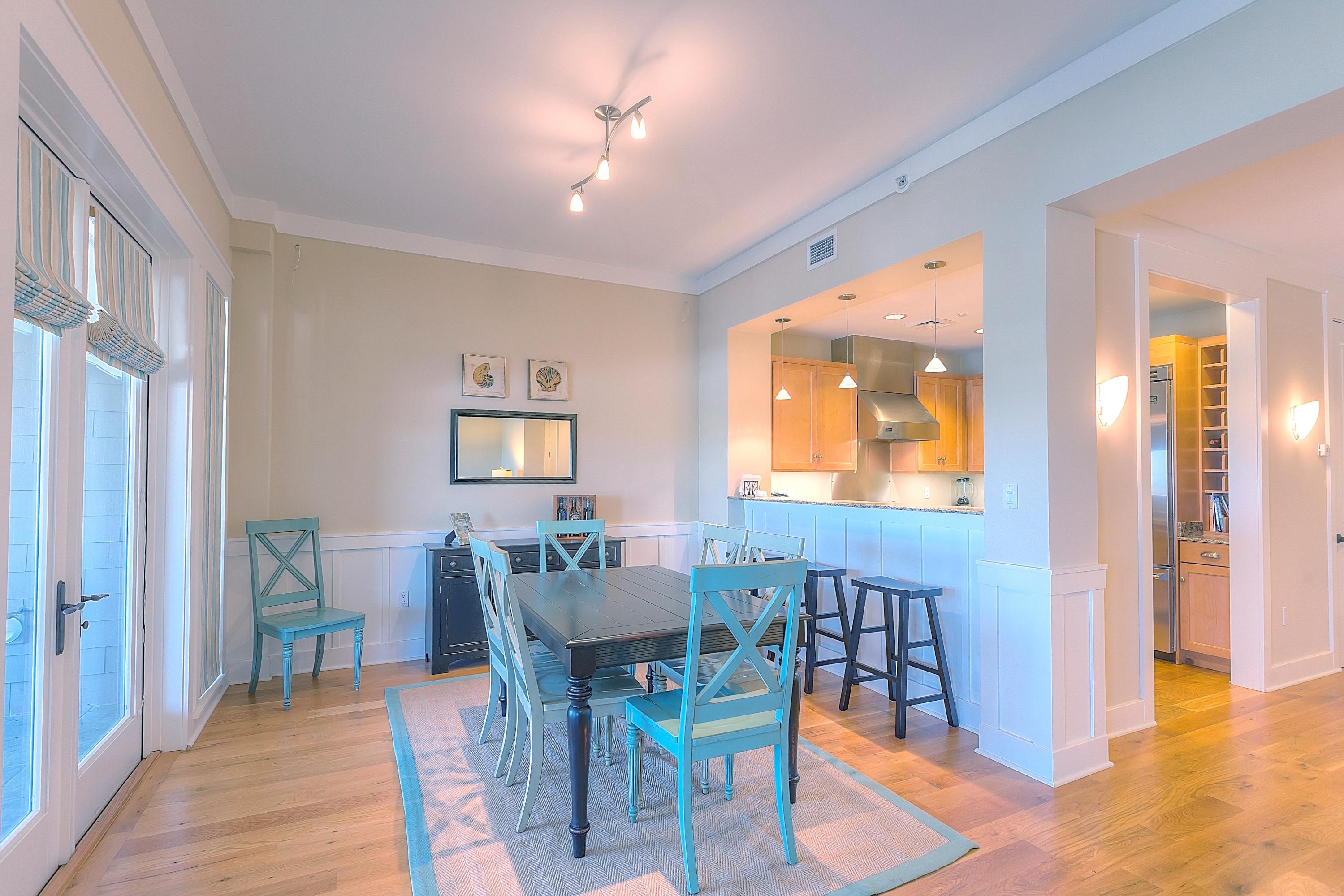 37 Compass Point Way, Unit 105 Watersound, FL 32461 - Photo 14 of 22 a view of a dining room with furniture and window