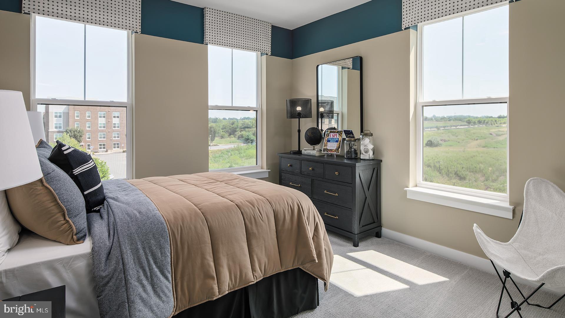 Tbb Cloongee Terrace, Unit CLARENDON Sterling, VA 20166 - Photo 9 of 14 a bedroom with a bed and wooden floor