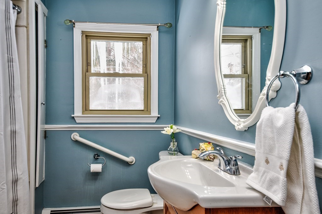 214 Great Road Stow, MA 01775 - Photo 15 of 23 a bathroom with a toilet sink and mirror