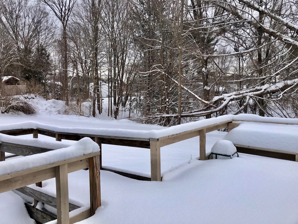 214 Great Road Stow, MA 01775 - Photo 19 of 23 a view of roof deck with furniture and trees
