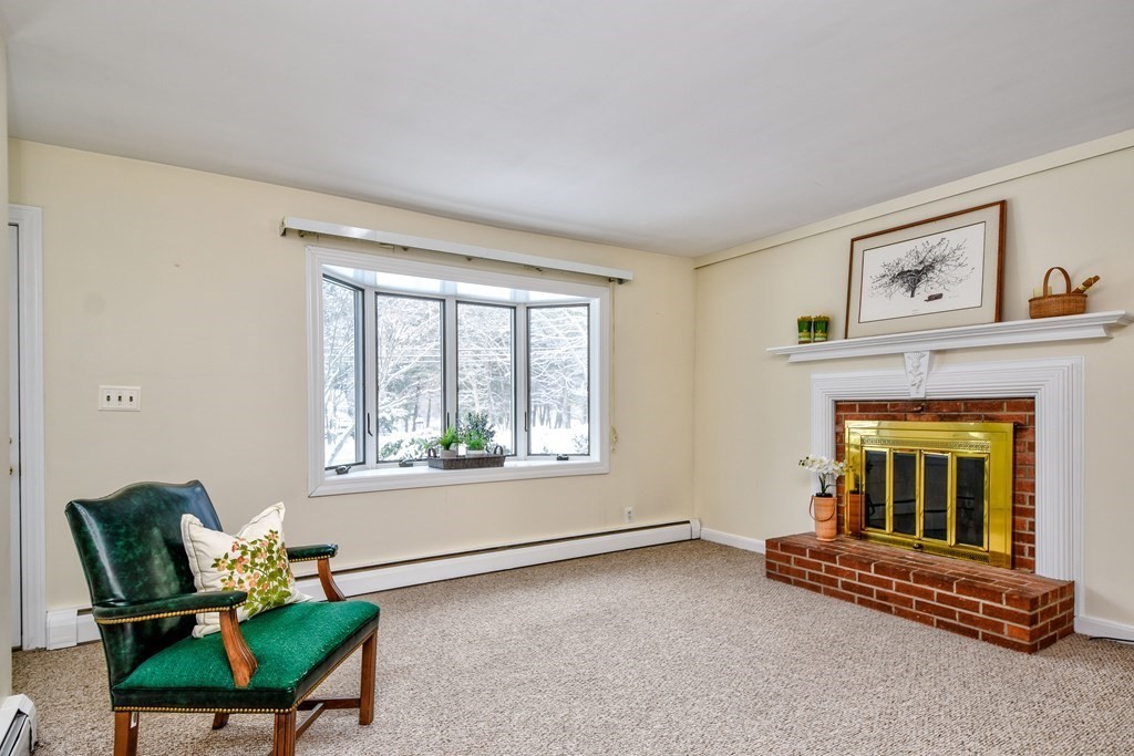 214 Great Road Stow, MA 01775 - Photo 7 of 23 a living room with furniture and a window