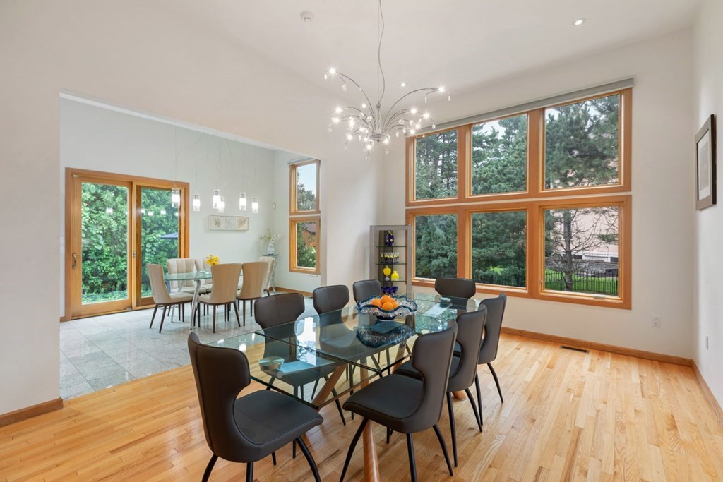 15 Deborah Road Newton, MA 02459 - Photo 7 of 33 a dining room with furniture large windows and wooden floor
