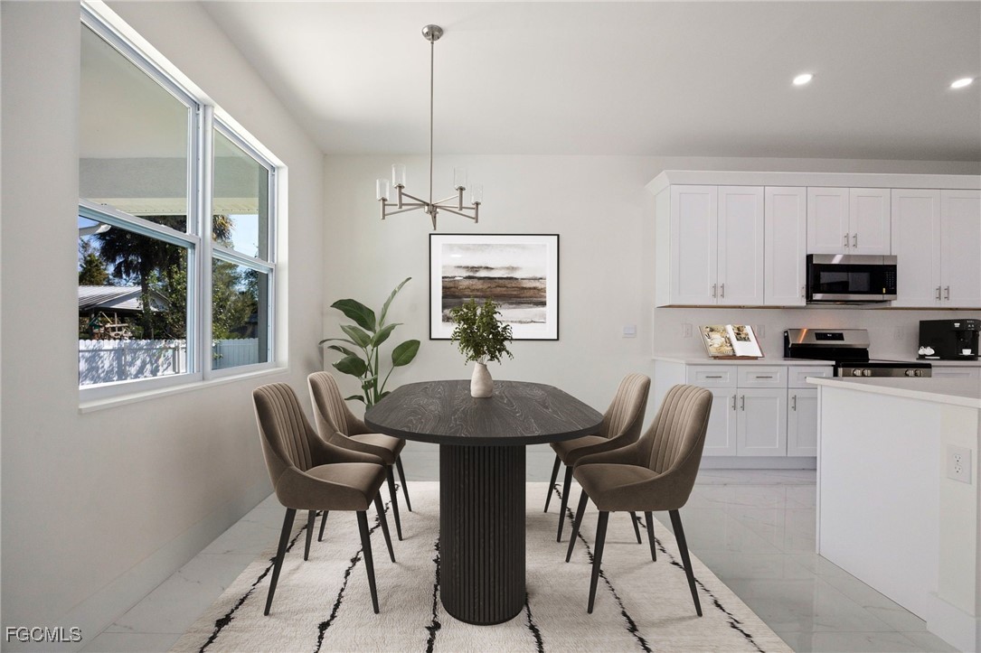 3002 Mercer Way LaBelle, FL 33935 - Photo 12 of 38 a view of a dining room with furniture window and outside view