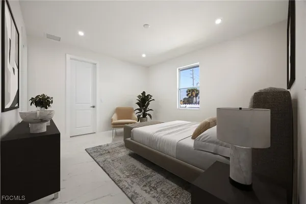 a view of a back yard with a large tree front of the house