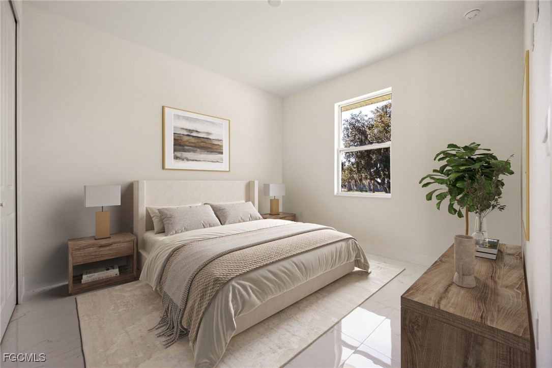 3002 Mercer Way LaBelle, FL 33935 - Photo 22 of 38 a bedroom with a bed and a window