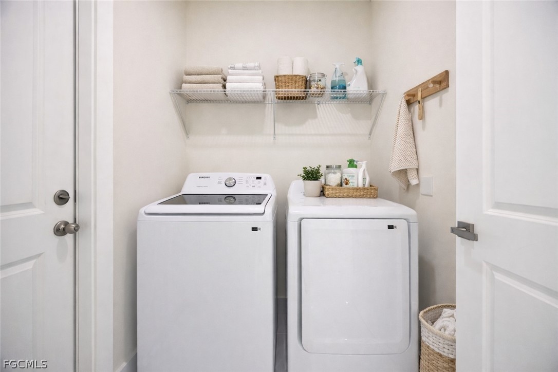 3002 Mercer Way LaBelle, FL 33935 - Photo 25 of 38 a utility room with dryer and washer