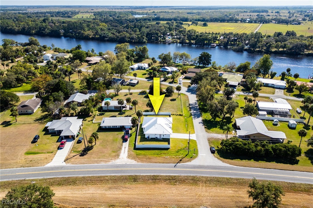 3002 Mercer Way LaBelle, FL 33935 - Photo 36 of 38 an aerial view of residential houses with outdoor space