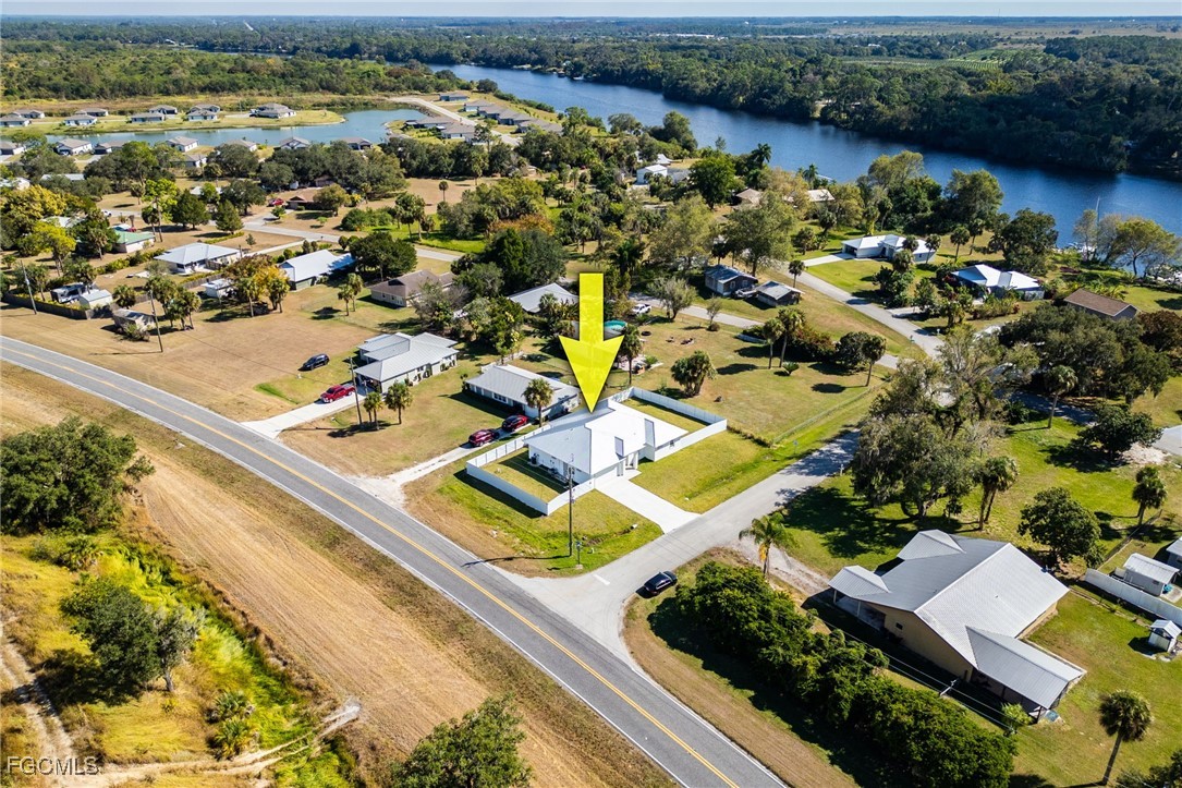 3002 Mercer Way LaBelle, FL 33935 - Photo 37 of 38 an aerial view of residential houses with outdoor space