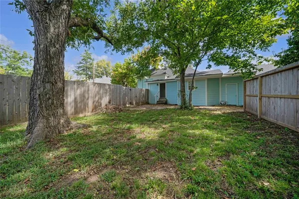 a backyard of a house with lots of green space