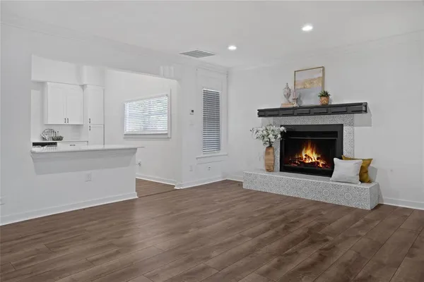 a view of an empty room with a fireplace
