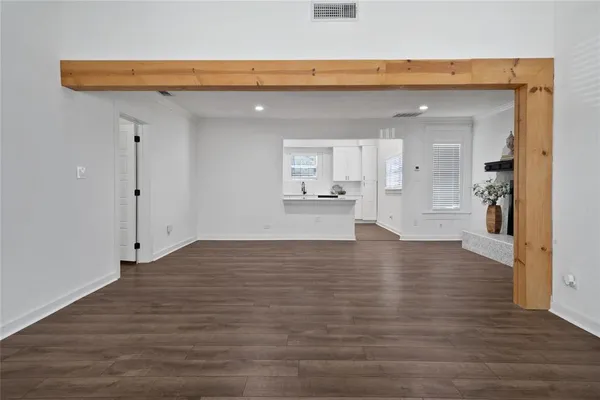 a view of a kitchen with a sink and cabinets