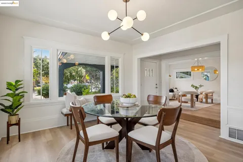 a kitchen with kitchen island white cabinets and sink