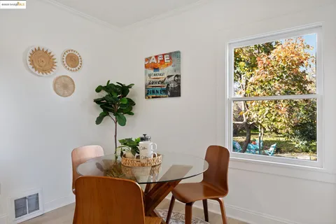 a table and a vase of flowers sitting on a table