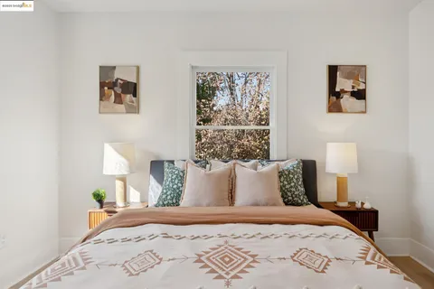 a bedroom with bed and a window