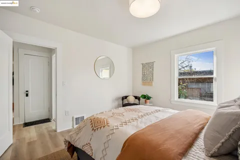 a bedroom with furniture and a window