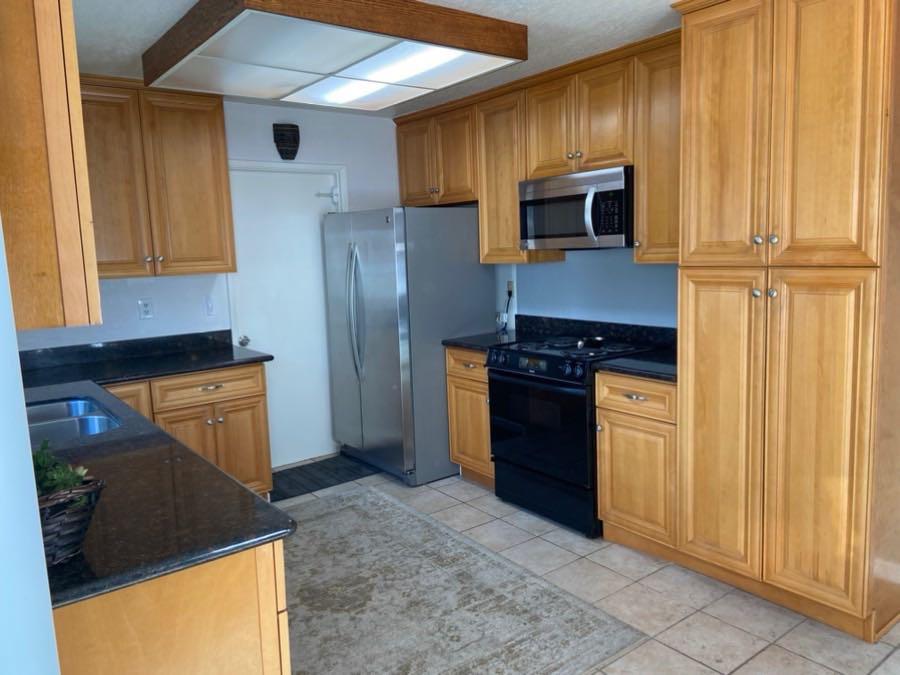 470 Suncrest Way Watsonville, CA 95076 - Photo 7 of 15 a kitchen with granite countertop a refrigerator stove and microwave