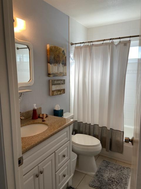 470 Suncrest Way Watsonville, CA 95076 - Photo 9 of 15 a bathroom with a granite countertop sink toilet a mirror a vanity and shower