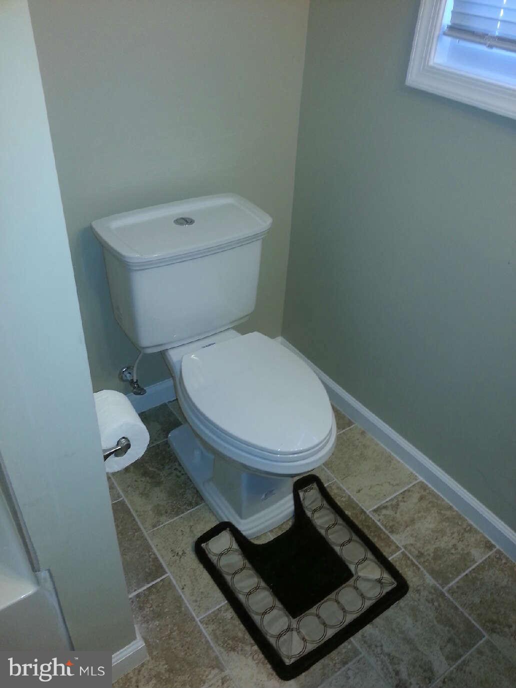414 North Bend Road Baltimore, MD 21229 - Photo 12 of 27 a bathroom with a toilet and a sink