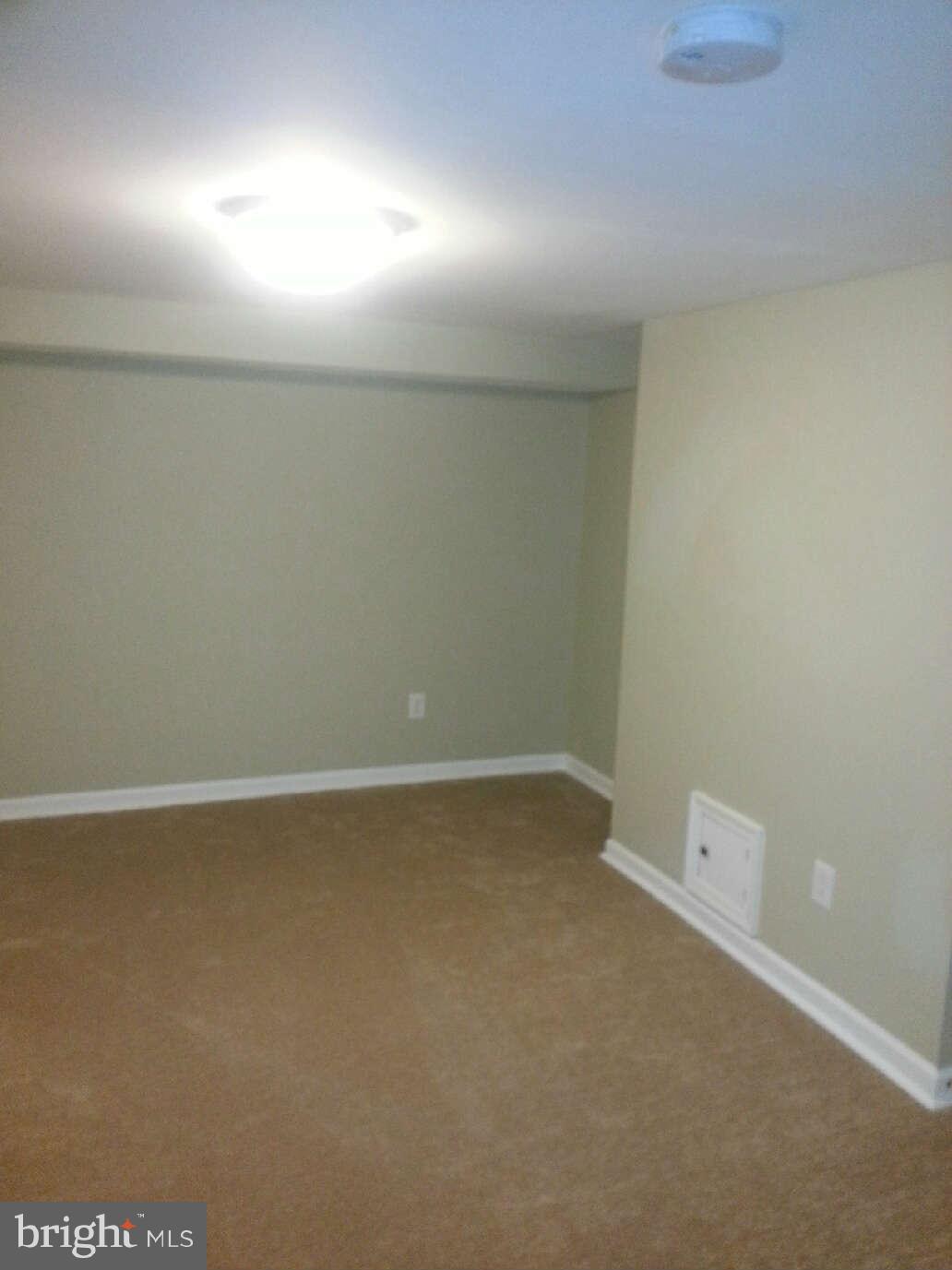 414 North Bend Road Baltimore, MD 21229 - Photo 14 of 27 an empty room with a workbench