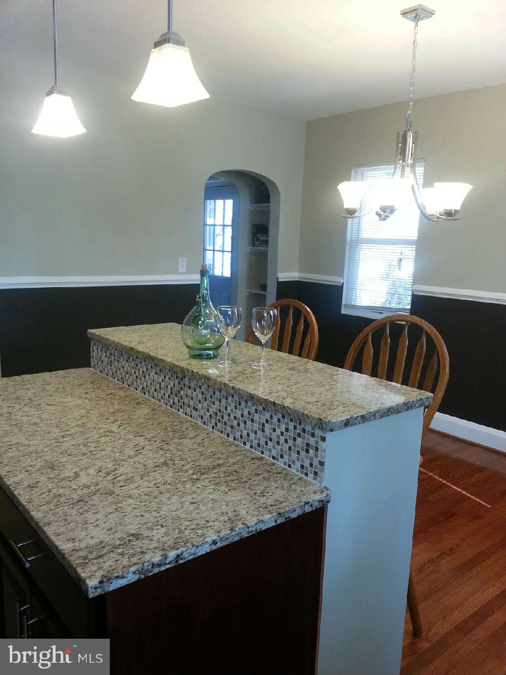 414 North Bend Road Baltimore, MD 21229 - Photo 18 of 27 a view of dining room and chandelier