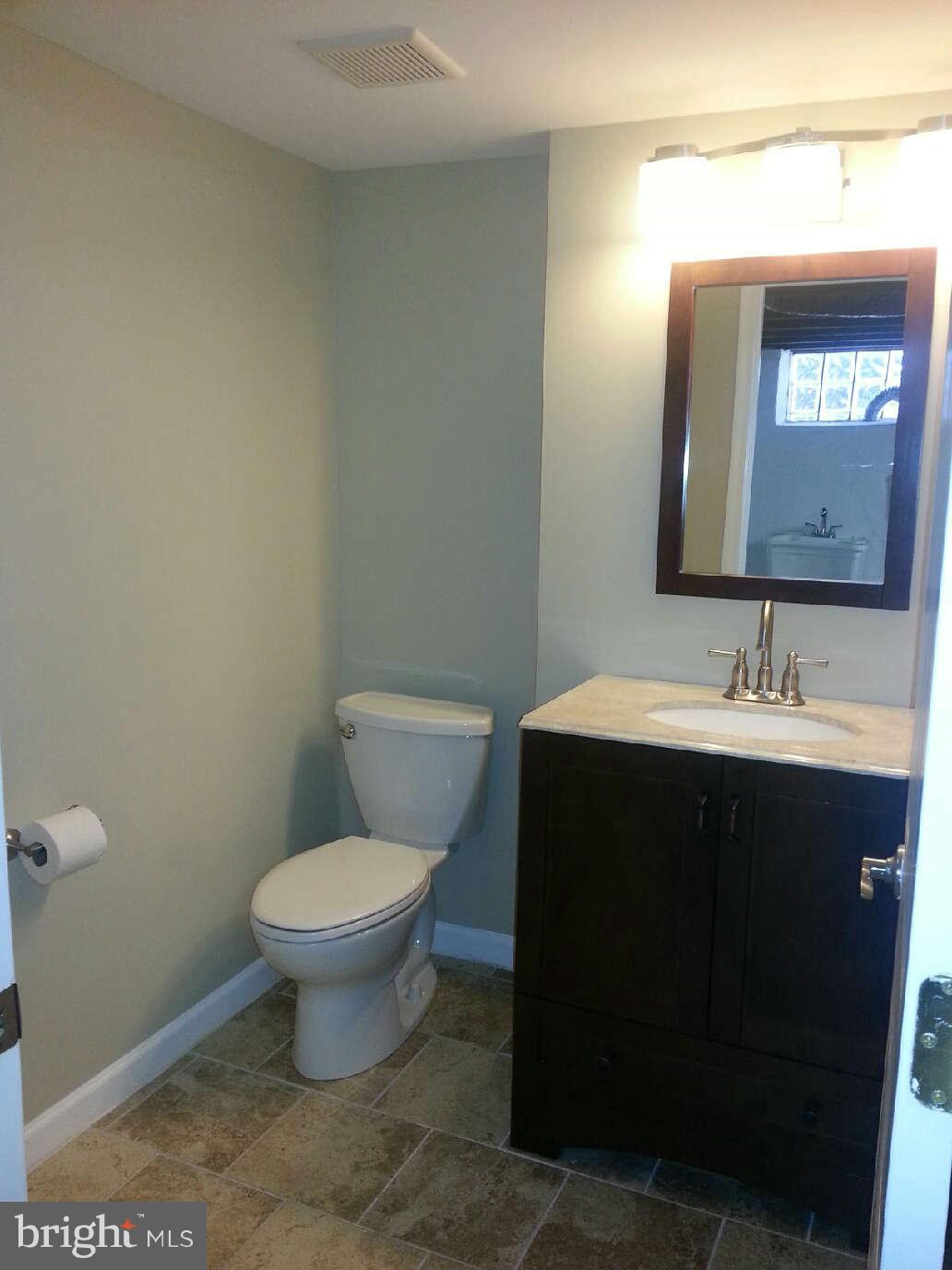 414 North Bend Road Baltimore, MD 21229 - Photo 24 of 27 a bathroom with a sink and a toilet