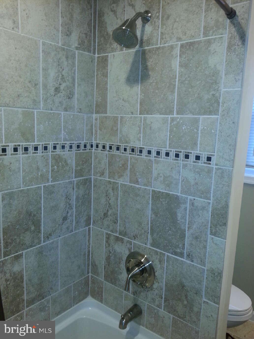 414 North Bend Road Baltimore, MD 21229 - Photo 8 of 27 a bathroom with a shower