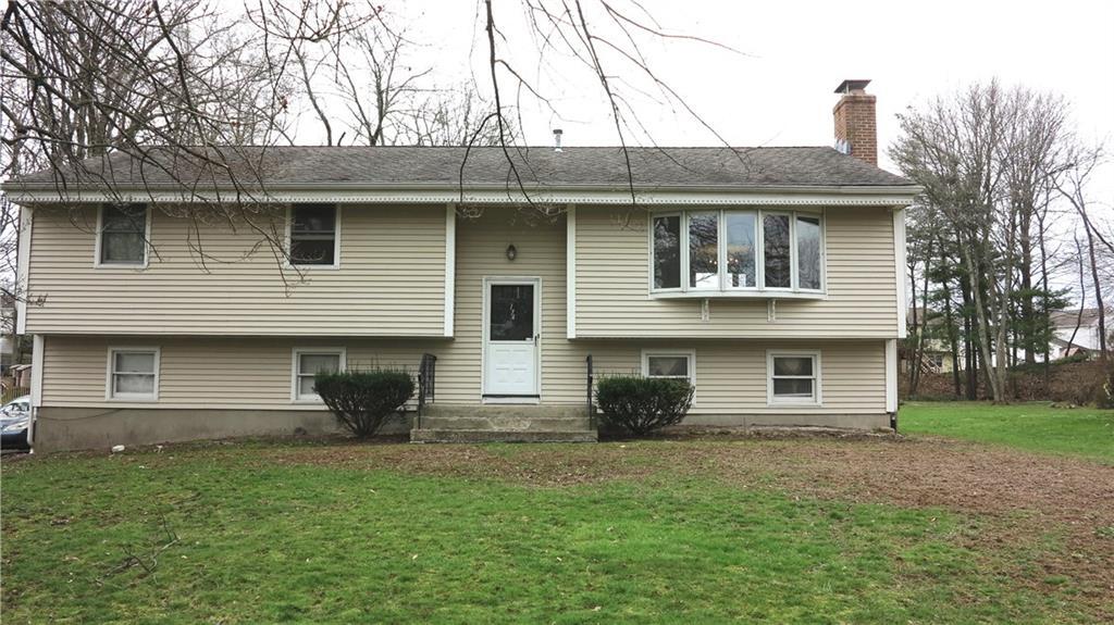 174 Sandy Lane Meriden, CT 06450 - Photo 1 of 1 a front view of a house with a garden
