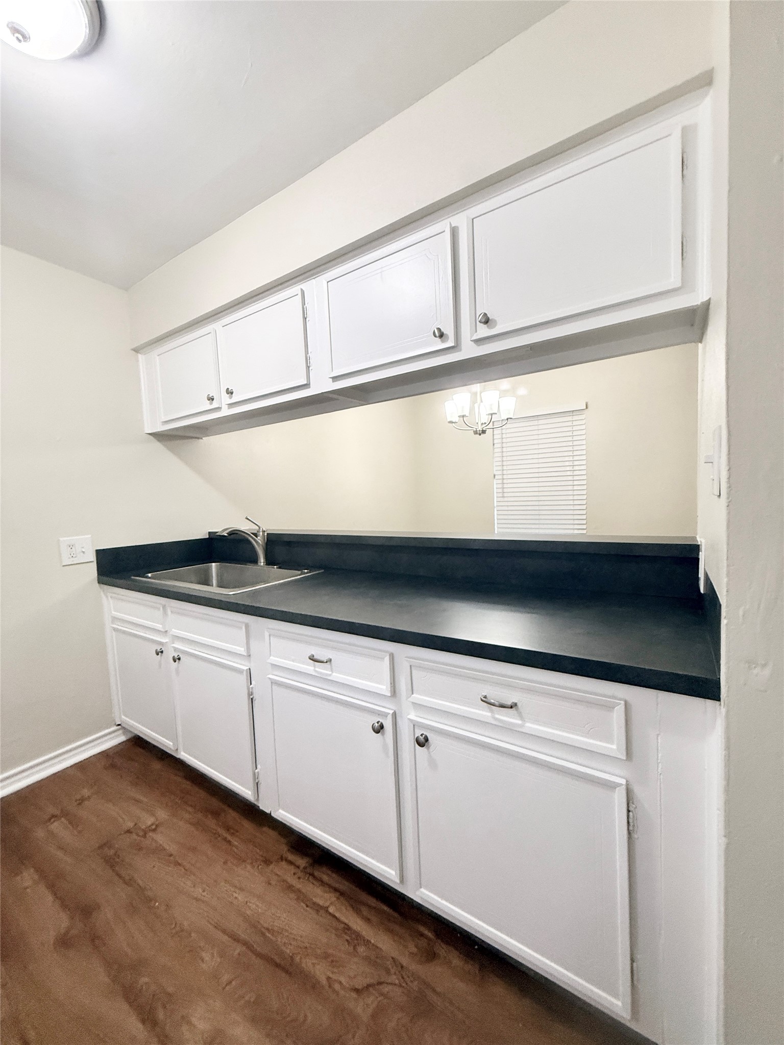 321 East Cedar Street, Unit 7 Angleton, TX 77515 - Photo 7 of 16 a close view of cabinets and window