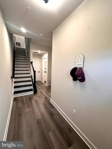 a view of entryway with wooden floor