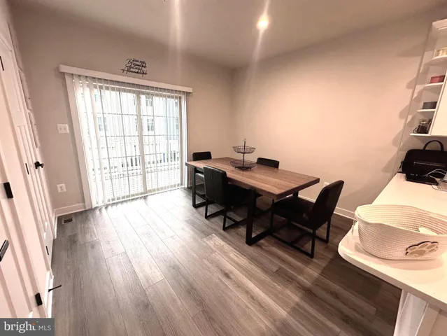 a workspace with furniture hardwood and a window