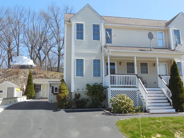 front view of a house with a garden