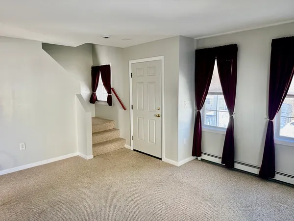 a view of an entryway with hallway