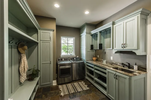a kitchen with stainless steel appliances granite countertop a stove and a sink