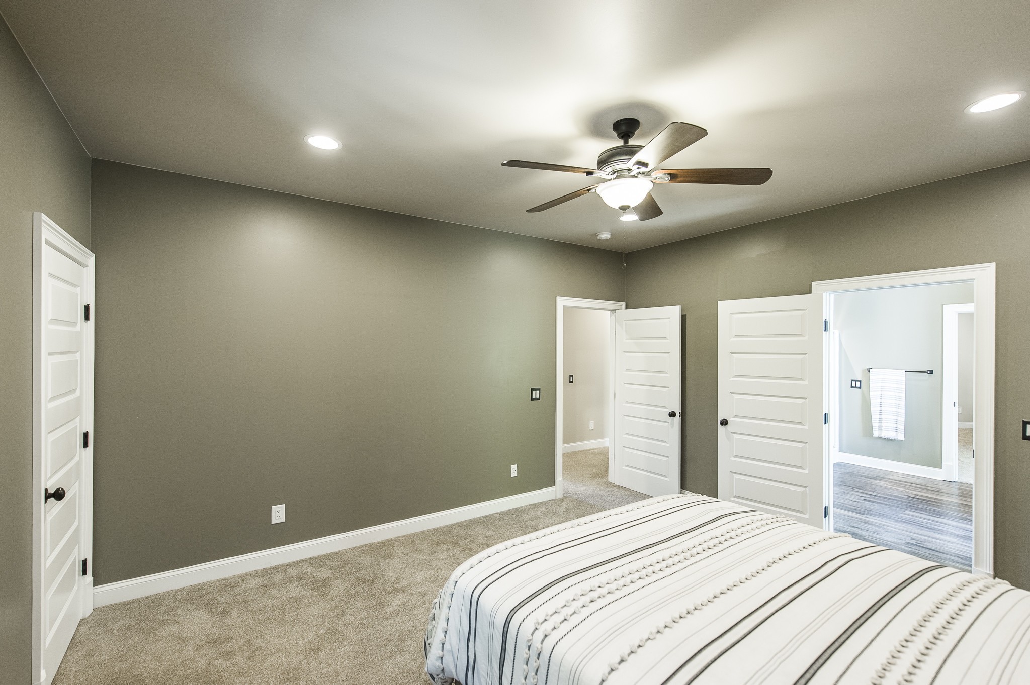 817 Burton Point Road Mount Juliet, TN 37122 - Photo 25 of 41 a bedroom with a bed and a chandelier