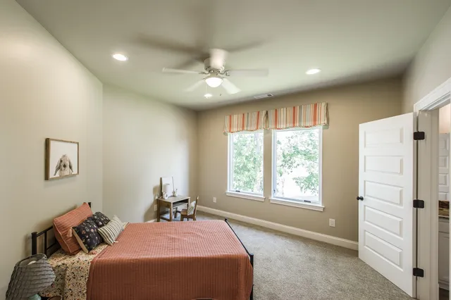 a bed room with a bed and a window