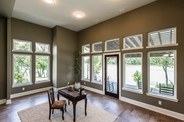 a dining room with furniture and windows