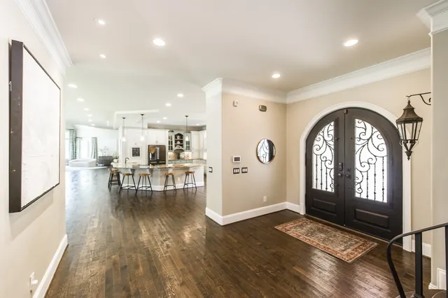 a view of a livingroom with furniture hardwood floor and a living room