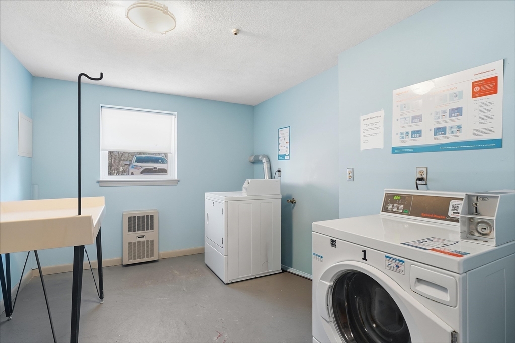 237 Main Street, Unit A4 Reading, MA 01867 - Photo 17 of 22 a utility room with dryer and washer