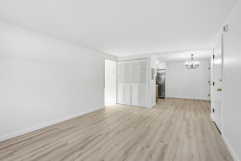237 Main Street, Unit A4 Reading, MA 01867 - Photo 7 of 22 a view of a livingroom with wooden floor