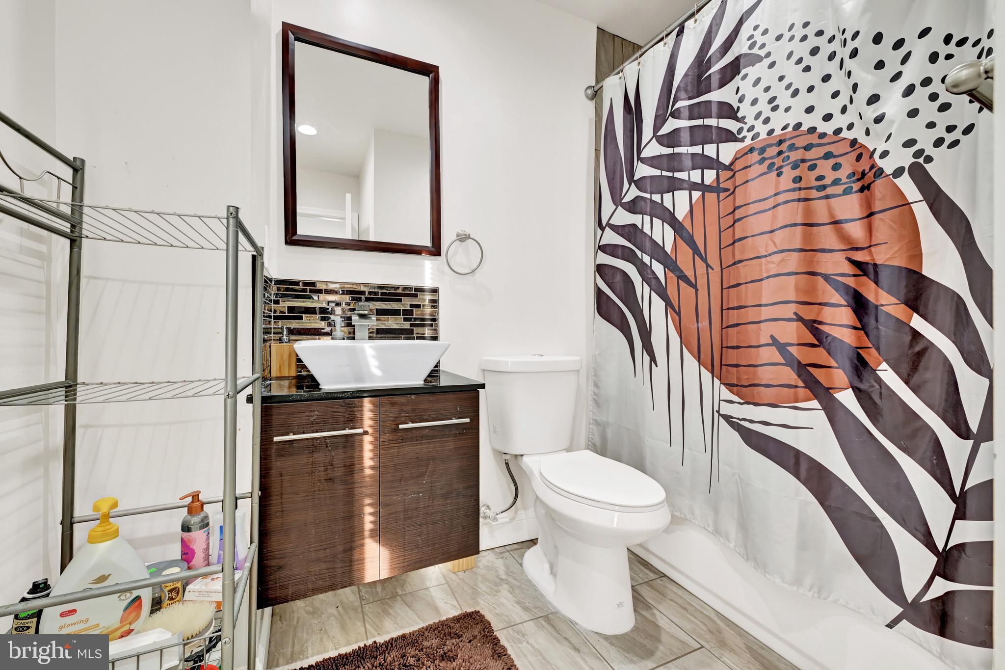 1401 East Lanvale Street Baltimore, MD 21213 - Photo 14 of 17 a bathroom with a toilet and a sink