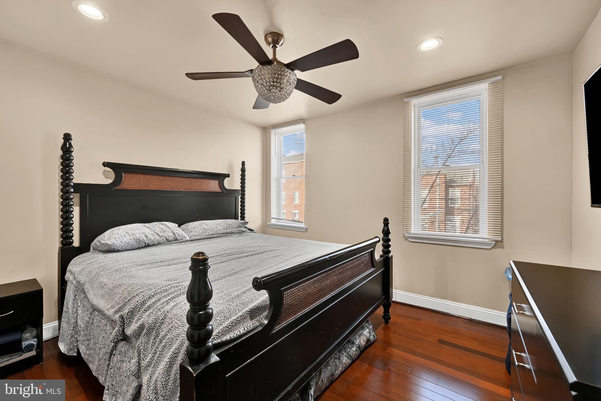 1401 East Lanvale Street Baltimore, MD 21213 - Photo 9 of 17 a bedroom with a bed and a window