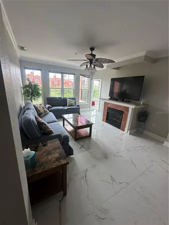 a living room with furniture and a large window